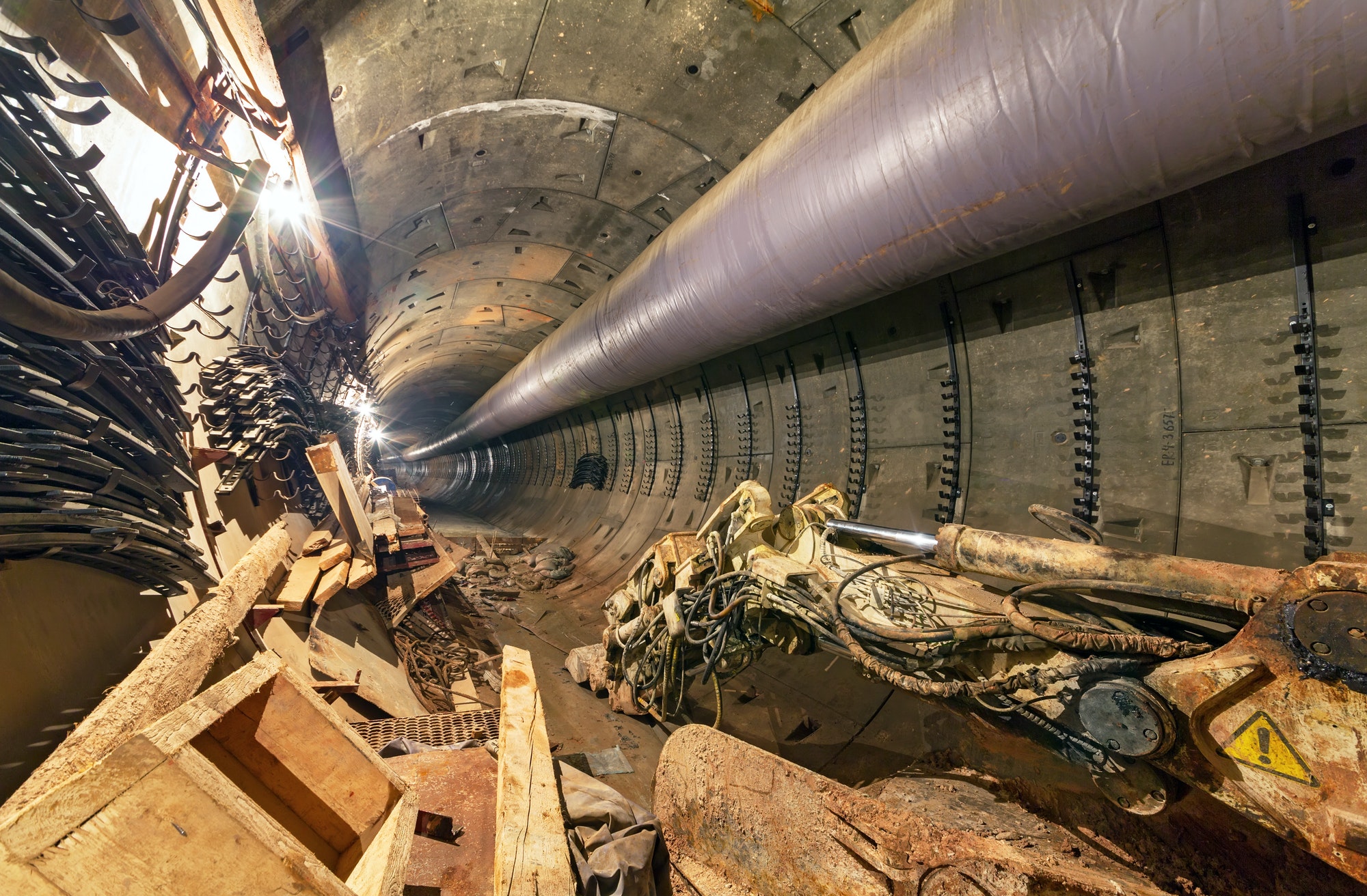 Construction garbage and bucket of construction equipment in the subway tunnel